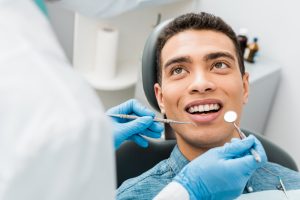 patient at the dentist getting a cleaning and checkup